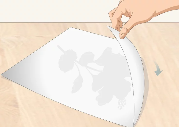 Turn the copy of the drawing face down on a flat, sturdy surface