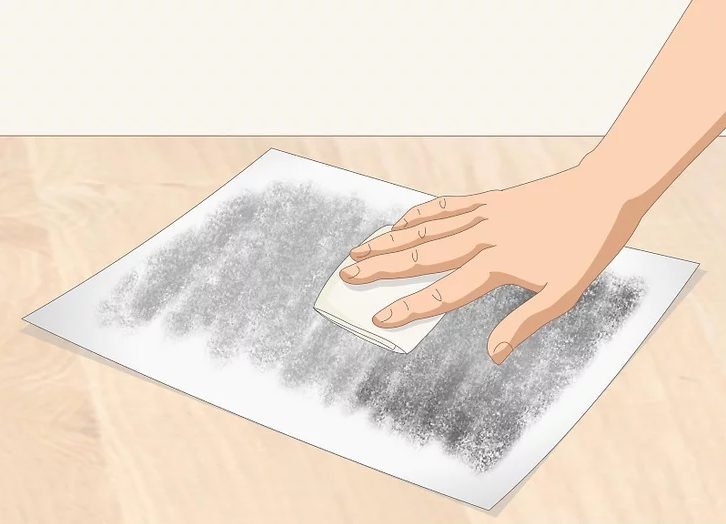 Blend the charcoal into the paper using a folded paper towel.